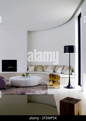 Floor lamp next to sofa in living room in Australian home Stock Photo