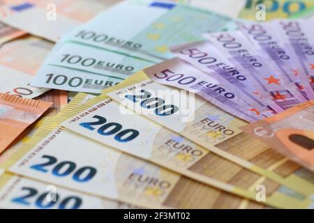 Euro currency banknotes background. European paper money texture with 50, 100, 200 and 500 euros bills. Stock Photo