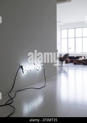 Wall light spells goodbye in hallway of USA home Stock Photo
