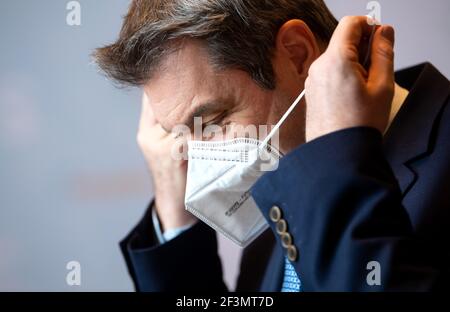 Munich, Germany. 17th Mar, 2021. Markus Söder (CSU), Prime Minister of Bavaria, takes off his mask for a press statement before the start of a CSU parliamentary group meeting in the Bavarian state parliament. Credit: Sven Hoppe/dpa/Alamy Live News