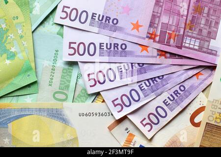 Euro currency banknotes background. European paper money backdrop with 100, 200 and 500 euros bills. Stock Photo