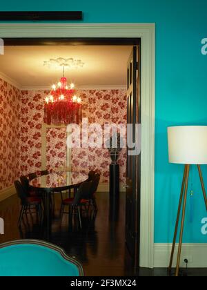 Chandelier above table in dining room in Australian home Stock Photo