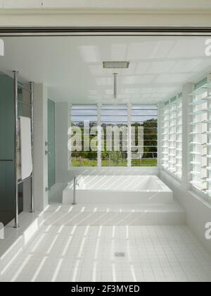 Sunken bath in wet room in Australian home Stock Photo