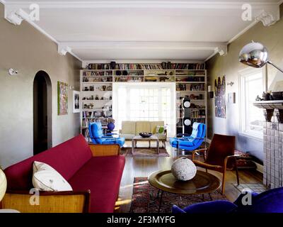 Seating around coffee table in living room in USA home Stock Photo