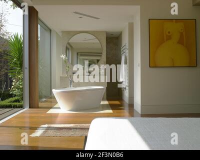 Freestanding bathtub in bedroom in Australian home Stock Photo