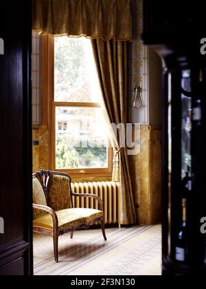 Seating in bay window of French home Stock Photo