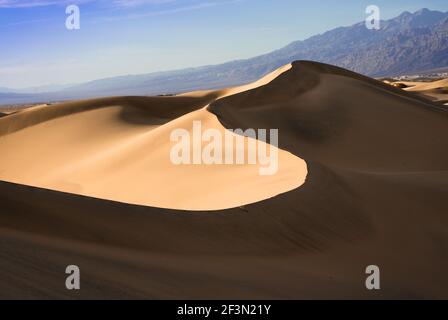 Beautiful sand dunes landscape seen at Death Valley National Park, California at sunset Stock Photo