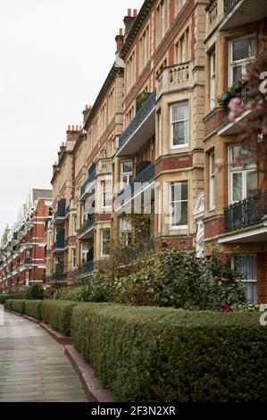 Exterior of Victorian red brick mansion block Stock Photo