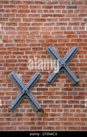 Brick building with steel bars in windows Stock Photo - Alamy
