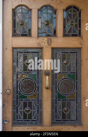 Stained glass inlays on a front door of a domestic house, Peckham, London, SE15, England | NONE | Stock Photo