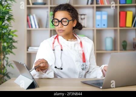 Doctor helping patient via telehealth making video call