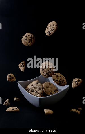 Chocolate chip cookies in dark background Stock Photo