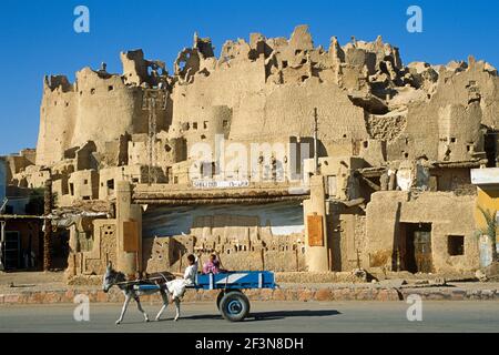 The ancient fortress of Siwa, built of natural rock salt, mud-brick and palm logs and known as the Shali Ghali, are built in the city of Siwa.  Kharsi Stock Photo