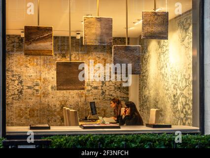 Two office workers at a desk, London, England, UK. Stock Photo