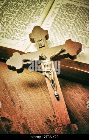 old Holy Bible book and wooden crucifix Stock Photo