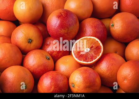 Many blood oranges, whole and halved (full frame) Stock Photo