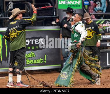 Keyshawn Whitehorse, professionall bull rider, celebrating his winning ride in Glendale, AZ Stock Photo