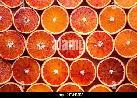 Pattern of sliced oranges prepared for juice making Stock Photo