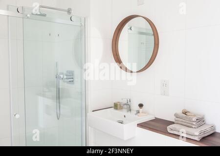 White bathroom in a modern country house in Cambridge. A house combining modern minimalist style with display of traditional objects used in every day Stock Photo