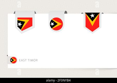 Label flag collection of East Timor in different shape. Ribbon flag template of Timor-Leste hanging from paper or different surface. Stock Vector