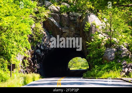 Marys rock tunnel in Shenandoah National park near blue ridge mountains in Virginia in summer with winding curve road through mountain forest Stock Photo