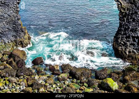 Closeup shore landscape view of famous Gatklettur arch rock near Hellnar National park Snaefellsnes Peninsula in Iceland on summer day Stock Photo