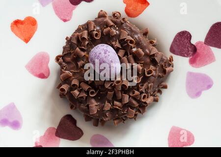 Cadbury Mini Eggs Nest Cake set on plate with hearts on Stock Photo