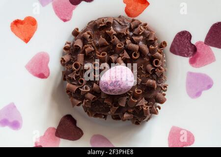 Cadbury Mini Eggs Nest Cake set on plate with hearts on Stock Photo
