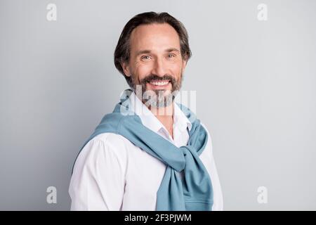 Photo of confident cute age man wear white shirt sweater shoulders smiling isolated grey color background Stock Photo