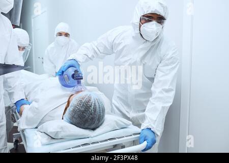 Doctors give resuscitation to a male patient in the emergency room Stock Photo
