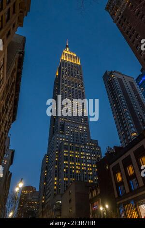 Looking up at the Empire State building at Night , New York, New York Stock Photo