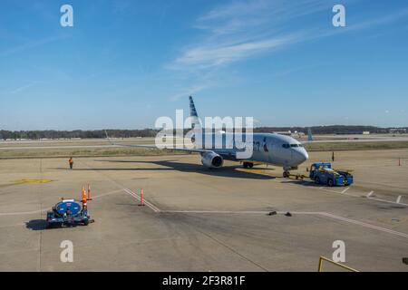 American airlines plane being pushed back from the gate at Memphis International airport Tennessee Stock Photo