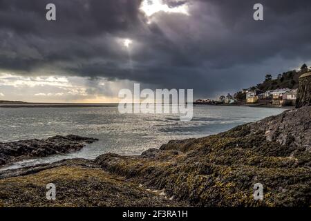 Threatening storm clouds gather over the estuary at Aberdovey in West Wales on a late spring afternoon Stock Photo