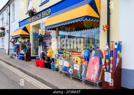 The Beach Shop, selling holiday souvenirs, windbreaks, body boards, buckets, spades and other beach toys, on the seafront at Westward Ho!, Devon, UK Stock Photo