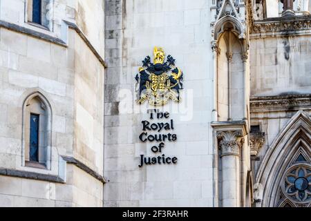 The royal coat of arms at the entrance to the Royal Courts of Justice, Strand, London, UK Stock Photo