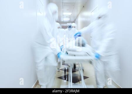 Team of doctors giving resuscitation to a male patient in the emergency room Stock Photo