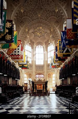 Heraldic banners in Henry VII's Chapel looking East, Westminster Abbey, London Stock Photo