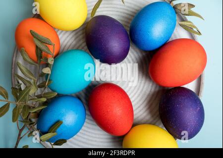 Multi-colored eggs on a blue. Easter holiday background Stock Photo