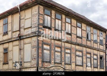 Old half-timbered house in need of renovation falls into ruin Stock Photo