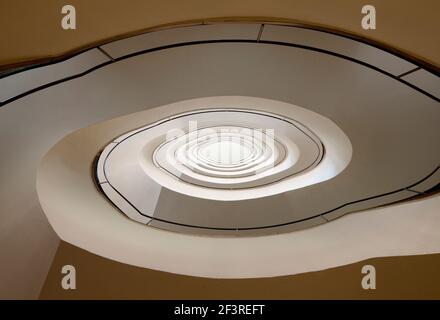 Spiral staircase viewed from below in highrise office block by Paul Bonatz, 1922-24, Dusseldorf, Germany Stock Photo