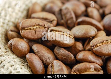 Closeup coffee beans with focus on one Stock Photo