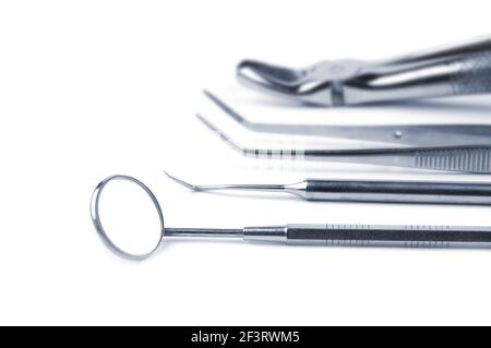 Dental tools on a white background. Selective focus. Stock Photo