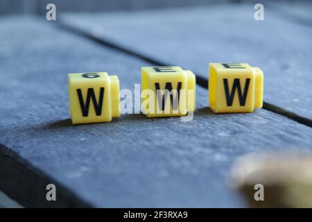 Text Www. Yellow letters on vintage background. Stock Photo