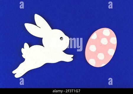 Easter bunny with easter painted egg, top view and flat lay composition Stock Photo
