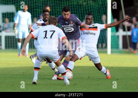 Stade Lorient FOOTBALL - FRIENDLY GAMES 2012/2013 - STADE RENNAIS v FC LORIENT -  21/07/2011 - PHOTO PASCAL ALLEE / DPPI - ROMAIN ALESSANDRINI (RENNES) /  MAXIME BACA (L) AND CHEICK DOUCOURE (R) (FCL Stock Photo - Alamy