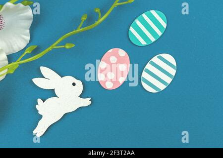 Cute Easter bunny with easter eggs, flat lay and creative composition with holiday decoration Stock Photo