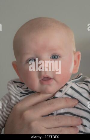 three month old girl with blue eyes Stock Photo