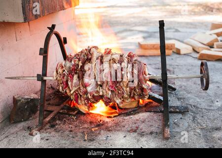 Pieces of raw lamb fat dumba are fried in a black cauldron, cooking food  Stock Photo - Alamy