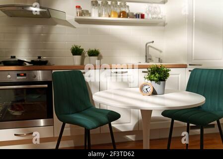 Modern stylish Scandinavian kitchen interior with kitchen accessories.  Bright white and grey kitchen with household items in studio apartment  Stock Photo - Alamy
