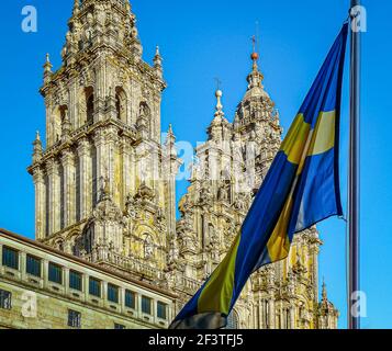 The Swedish flag in front of the Cathedral in Santiago de Compostela in the sunset, St. Jacobs day, July 25, the holy year 2010 Stock Photo